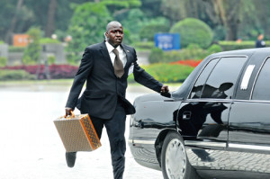 bodyguard for Gambian President Yahya Jammeh runs alongside the ...
