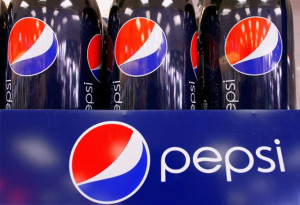 Bottles of Pepsi are dispalyed at a grocery store in Springfield, Ill ...