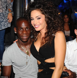 Attention-seeker: Balotelli with girlfriend Raffaella posing in a ...
