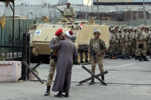 religious scholar kisses an army officer as a greeting before ...