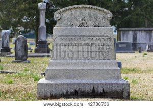 Old elaborate tombstone with quote from Book of Job Inscribed