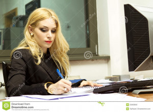 Young blonde Secretary in the office.