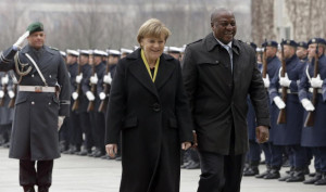 Angela Merkel, left, welcomes President of Ghana John Dramani Mahama ...
