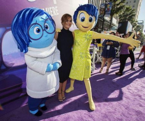with the characters of Sadness and Joy at the premiere of 