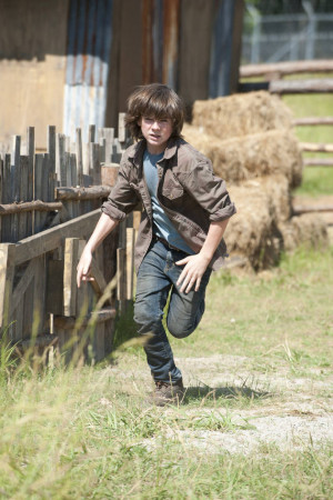 Outside, Carl rushes into Rick's arms. He admits to having used a gun ...