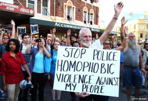 ... placard which reads: Stop police homophobic violence against my people