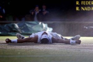 Rafael Nadal falls to the ground moments after winning the Wimbledon ...