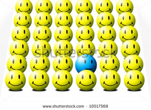 One blue face among several yellow faces signifying the odd-one-out ...