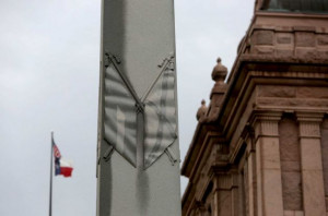 Grounds in Austin. A gray granite shaft features hand-carved quotes ...