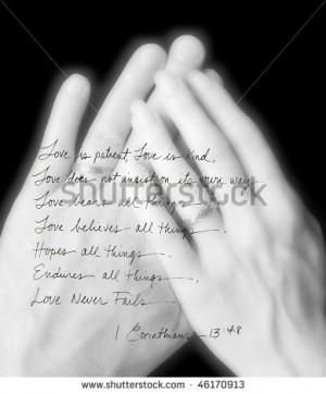 handwritten Corinthians layered over married hands - stock photo