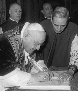 Pope John XXIII signs the bull convoking the Second Vatican Council ...