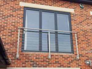 Stainless steel Juliette balcony with wire rails In private residence.