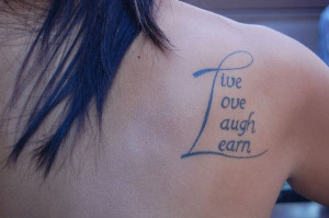 Live, Love, Laugh and Learn is the message of her tattoo on her arm ...