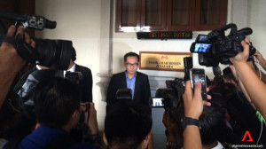 Photographers take pictures of Malaysian lawyer Eric Paulsen who has