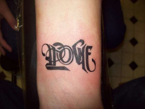 Love....upside down it says hate tattoo
