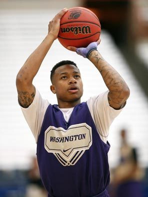 The Huskies' Isaiah Thomas takes a shot during practice Wednesday in ...