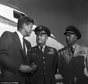 Kennedy (left) speaks with General Curtis LeMay (centre) and General ...