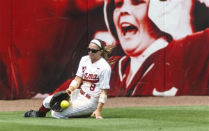 Alabama outfielder Haylie McCleney slides into a stop in the outfield ...