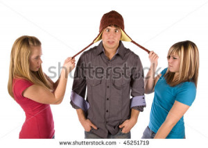 stock-photo-two-girls-fighting-over-a-boy-by-pulling-on-his-strings-on ...