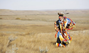 member of the Lakota First Nations performs a traditional dance at ...