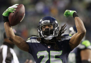 Seattle Seahawks' Richard Sherman celebrates after intercepting a pass ...