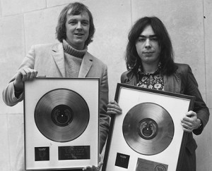 With Tim Rice again, displaying the gold and platinum discs awarded ...