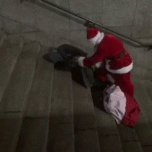 Santa Claus Reaches Into His Bag To Give a Homeless Man Some New ...