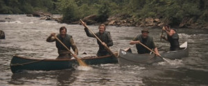 Pulling their canoe to the side of the river, two city dudes, Ed ...