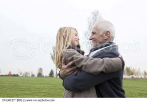 Grandfather and granddaughter outdoors