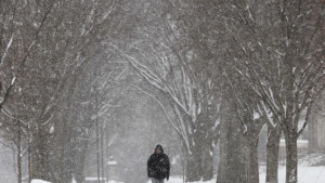 walks through the campus of Phillips Academy during a winter storm ...