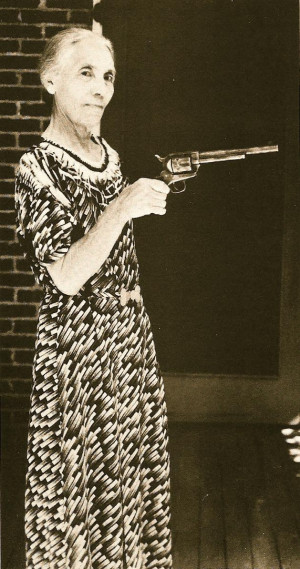 Pat Garrett's wife, holding the gun he used to kill Billy the Kid