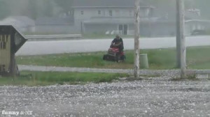 Funny Video Guy Mowing Grass During Hail Storm