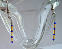 pair of blue and gold glass beaded dangle earrings university of ...