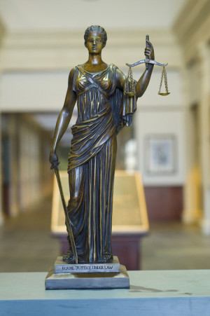 Lady Justice depicts justice as equipped with three symbols: a sword ...