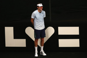 Greg Rusedski Greg Rusedski of Great Britain poses as a ball girl