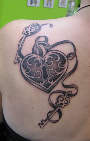 Lock and key tattoo on shest