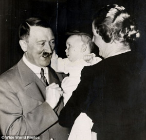 Uncle Adolf: Hitler pictured having his ear tugged by his god-daughter ...
