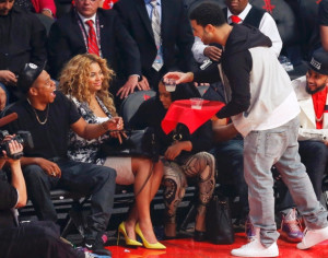 At your service! Drake hands over two drinks to Jay-Z and Beyonce, who ...