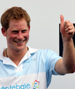 Britain's Prince Harry gives the thumbs up on the podium after a polo ...