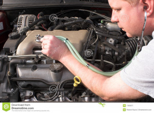 mechanic diagnosing engine problems.