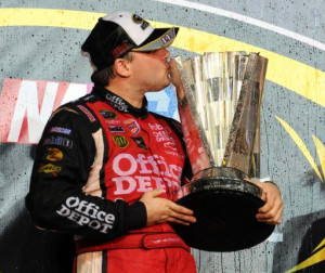Tony Stewart celebrates winning the NASCAR Sprint Cup Ford 400, and ...