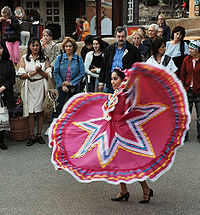 woman dancing folklórico in the traditional dress of Jalisco