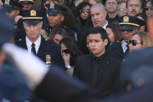 View full size Justin Ramos, 19, exits his father's funeral at Christ ...