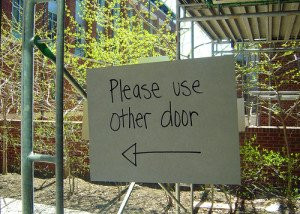 Please use other door”