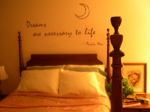 bedroom wall art decal above headboard in moon themed bedroom