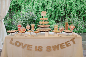 Decorate your sweet table with a “Love is Sweet” banner.