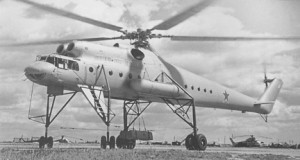 Old photo of a Mil Mi-10 with a S-58 visible in the background:
