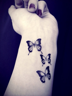 sister tattoos. Each gets a butterfly. Maybe I could get 4 small ...