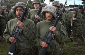 Female Marine recruits stand in formation following hand-to-hand ...