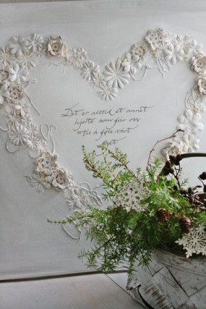 ... flowers on a painting canvas & hot glue crochet. In the middle, the